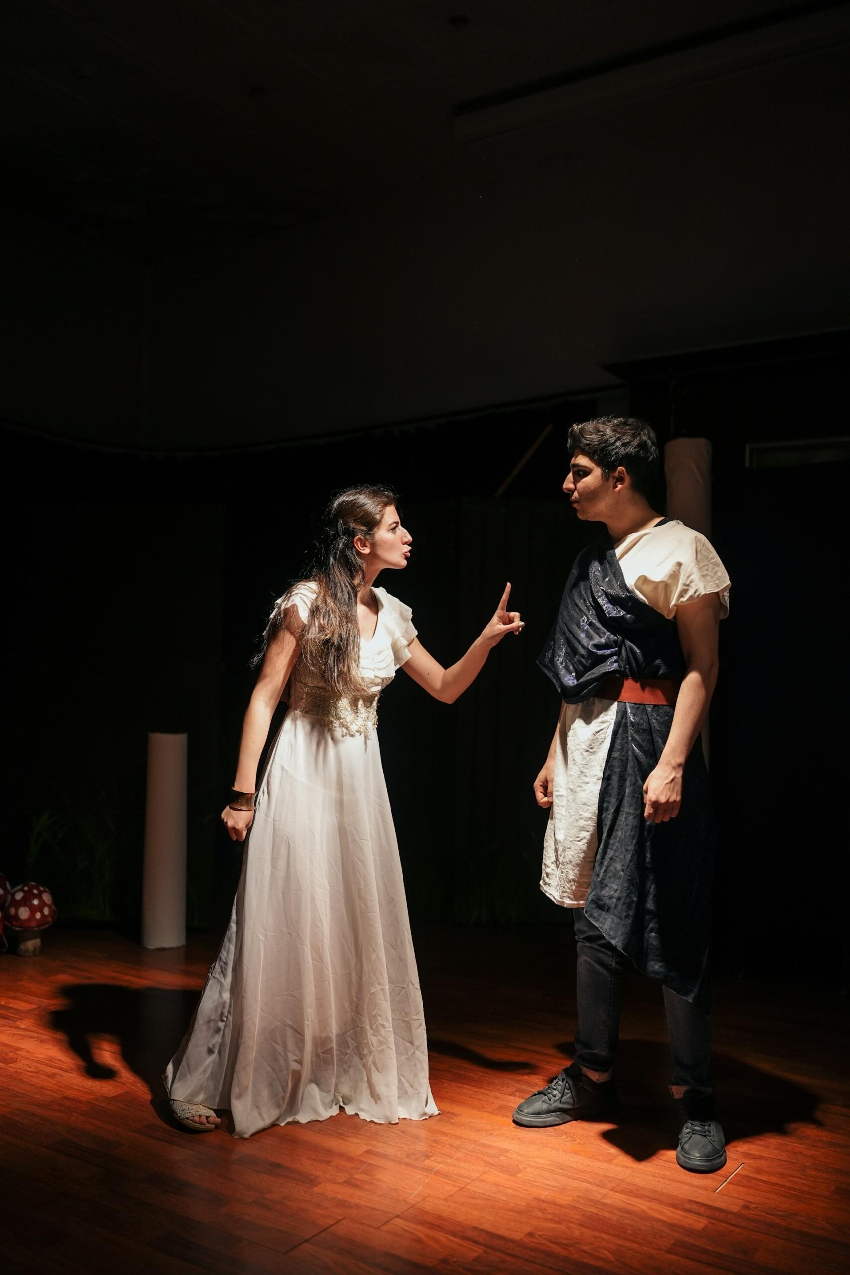 A couple dressed in ancient attire, showcasing traditional garments from a historical period.