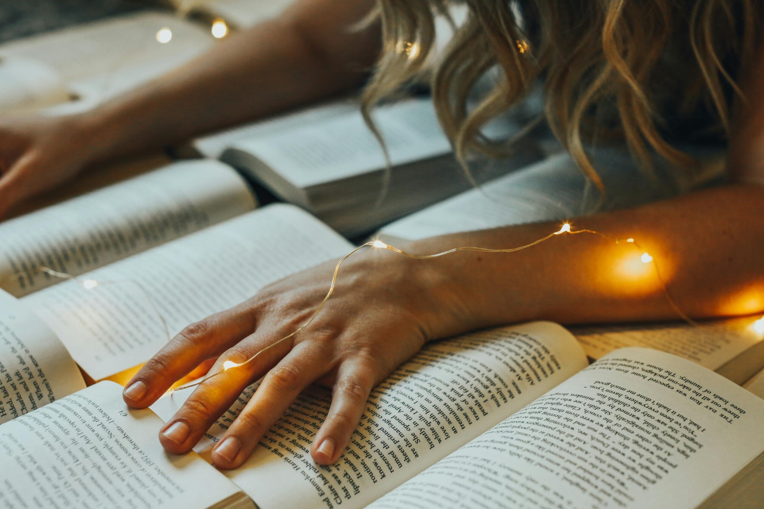 a woman with her hands on books